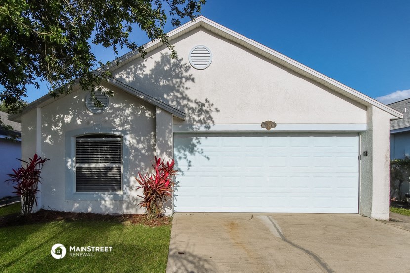 a white house with a white garage door