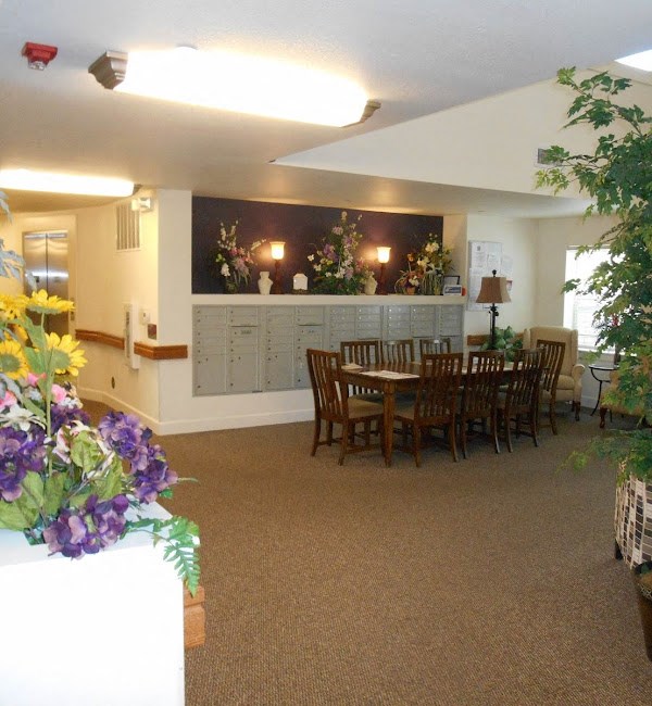 a dining room with a table and chairs