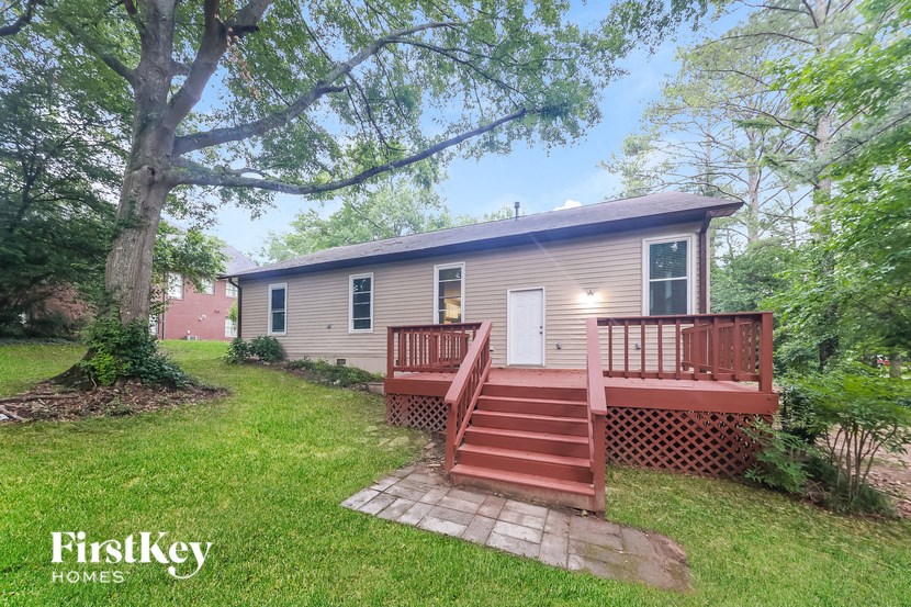 a small house with a porch and a deck