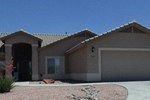 A house with a brown roof and a garage door.