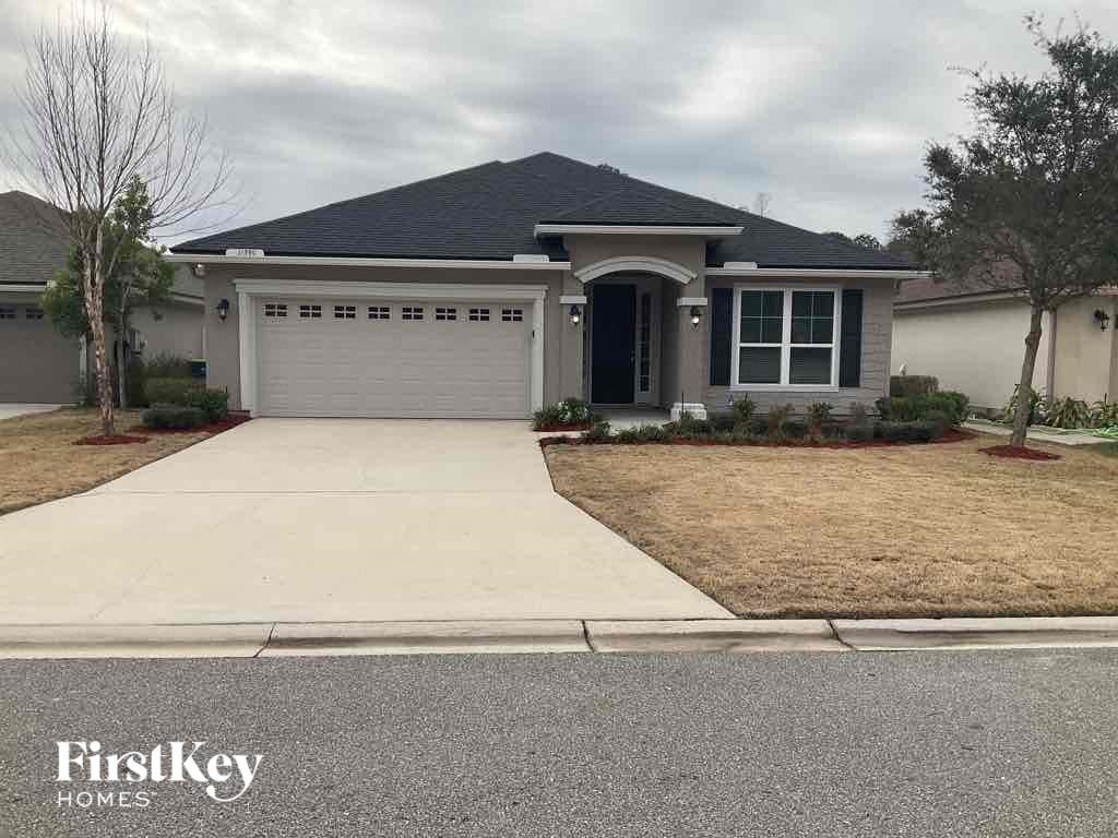 a house with a driveway and a garage door