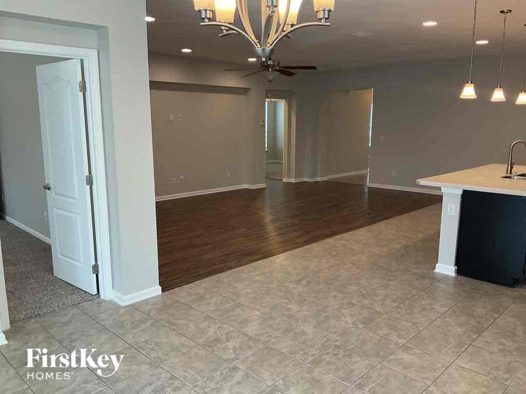 an empty living room and dining room in a house