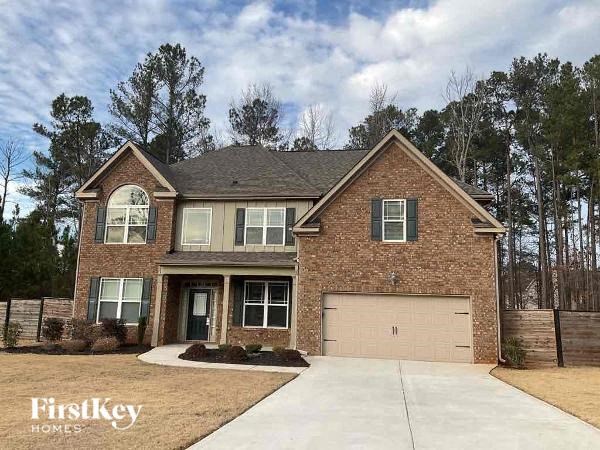 a brick house with a white garage door