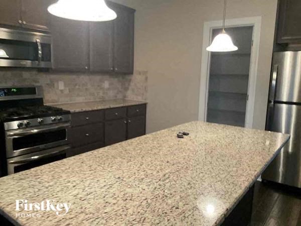 a kitchen with a marble counter top