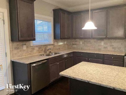 a kitchen with a counter top and a sink