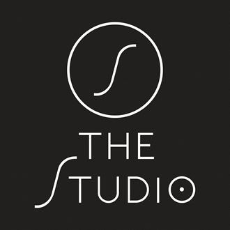 the studio logo with white circle on a black background