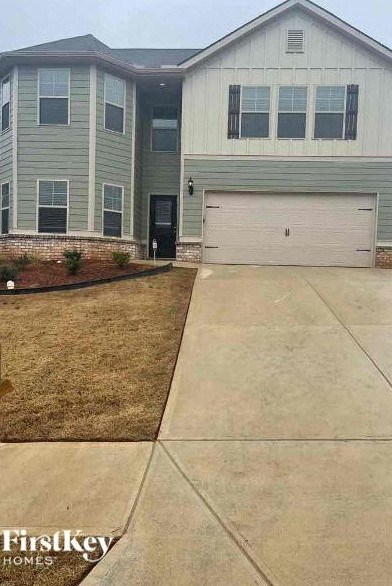 a house with a driveway and a white garage door