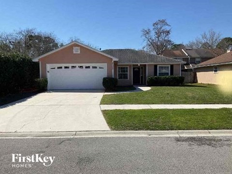 A house with a garage is for sale by FirstKey Homes.