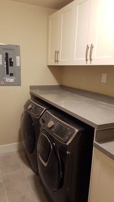 A washer and dryer in a laundry room.