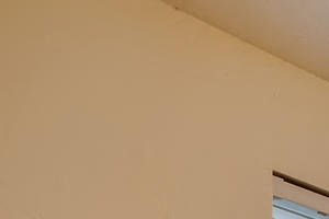 Apartments near Happy Valley for Rent - Sunnyside Village - Dining Room off of Kitchen with Large Window, White Walls, and Wood Flooring - Photo Gallery 6