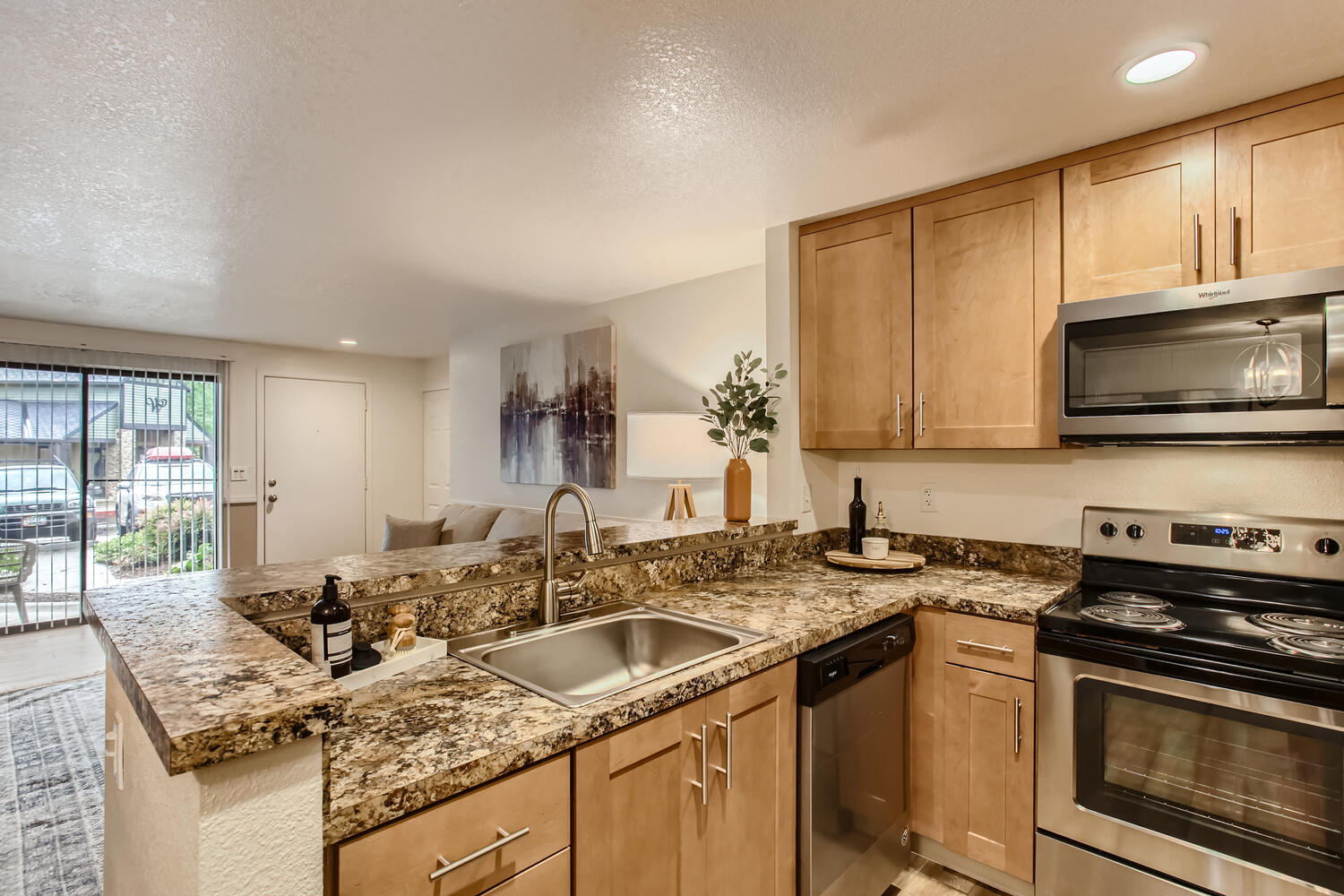 Lake Oswego Apartments for Rent - Westlake Meadows - Kitchen with Spacious Countertops, Stainless-Steel Appliances, and Wooden Cabinets