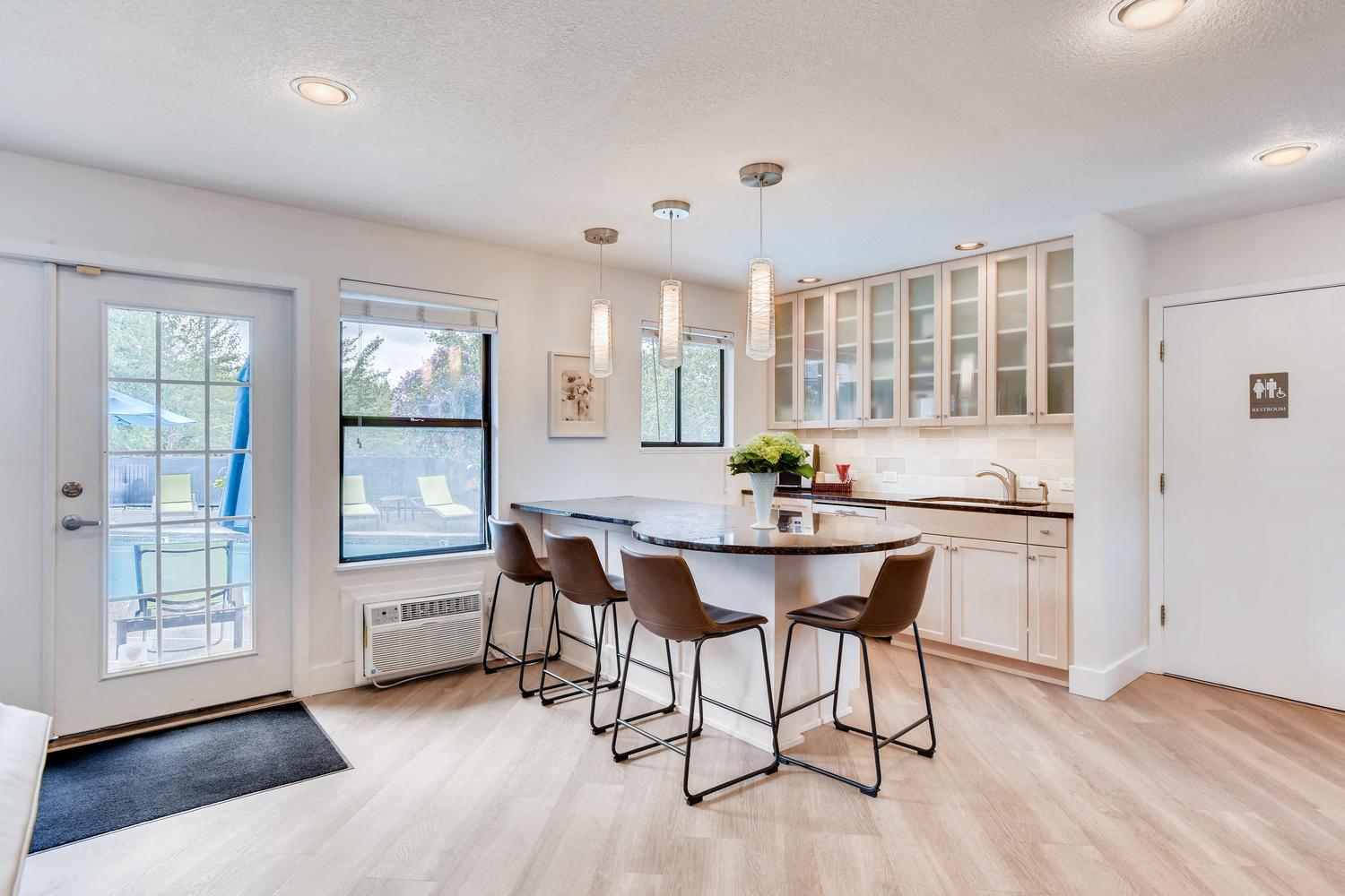 an open kitchen and dining room with a table and chairs