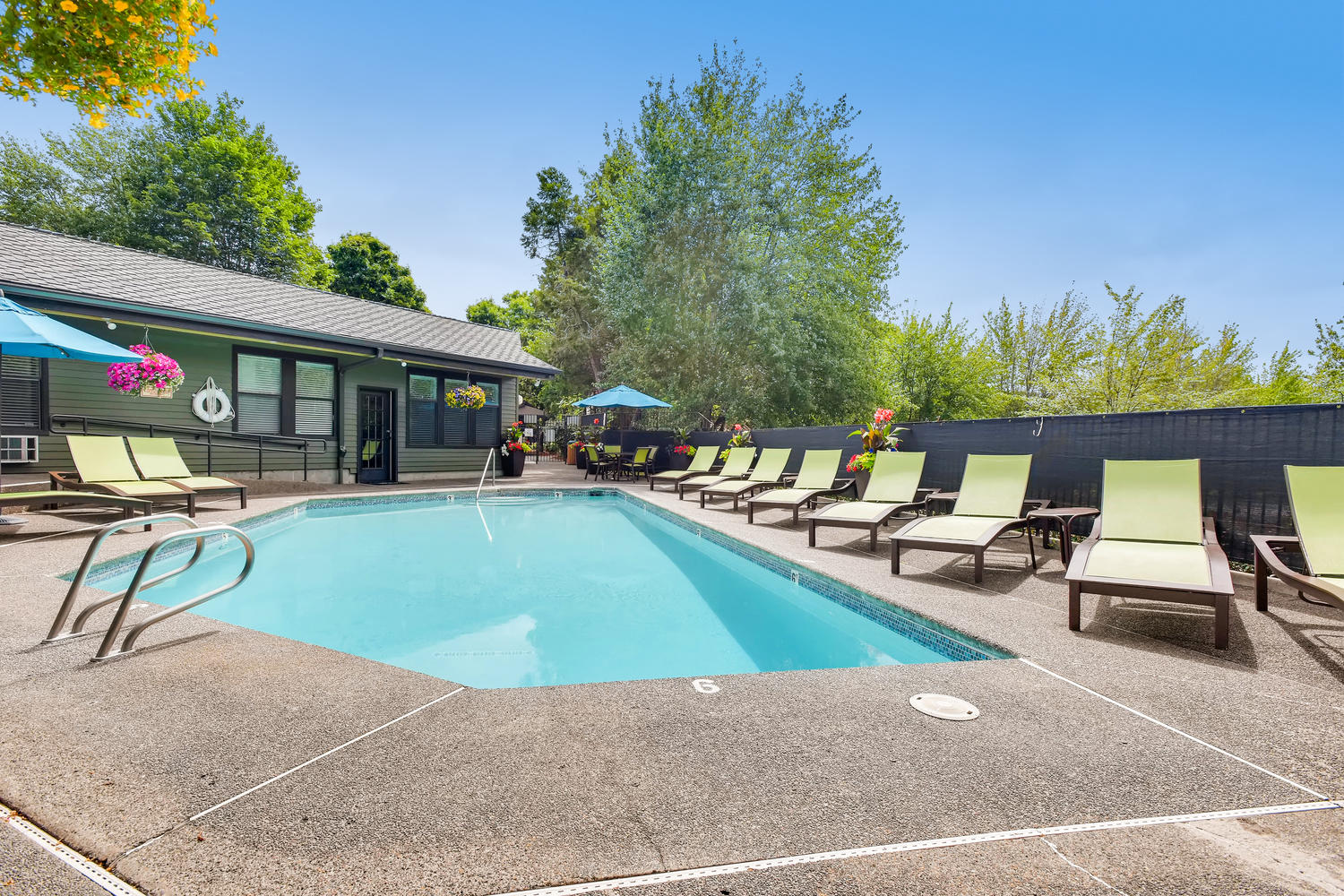 Apartments for Rent in Lake Oswego, OR - Westlake Meadows Swimming Pool with Lounge Chairs and Covered Table Seating