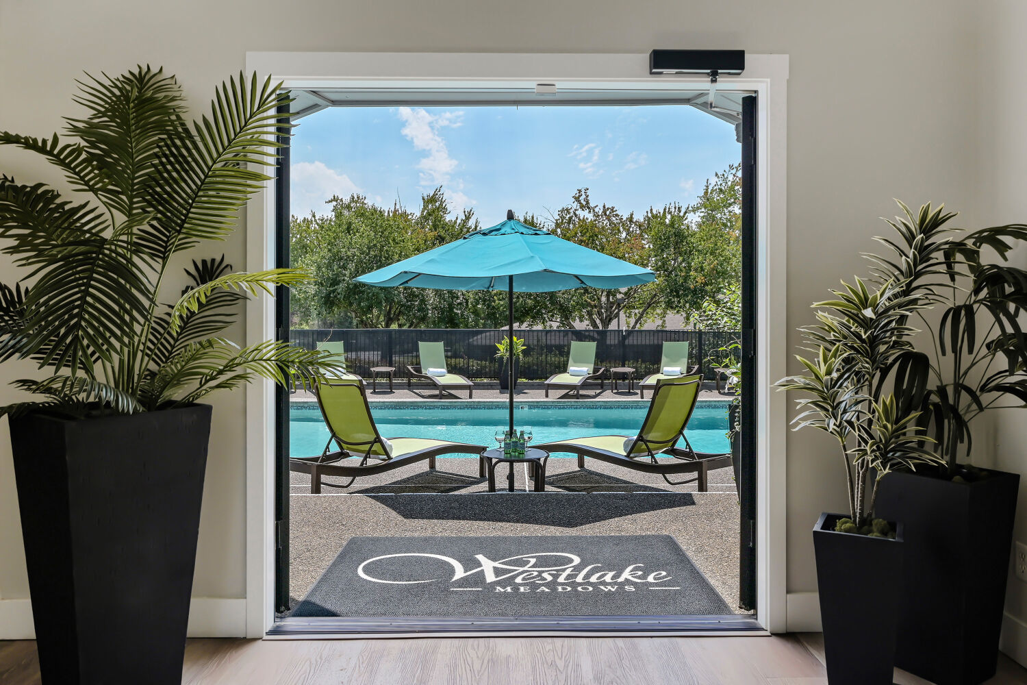 Apartments Lake Oswego for Rent - Westlake Meadows - An Exterior Shot Of The Swimming Pool Surrounded By Lounge Chairs And Umbrellas