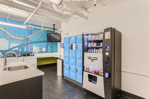 a kitchen with a vending machine and a sink