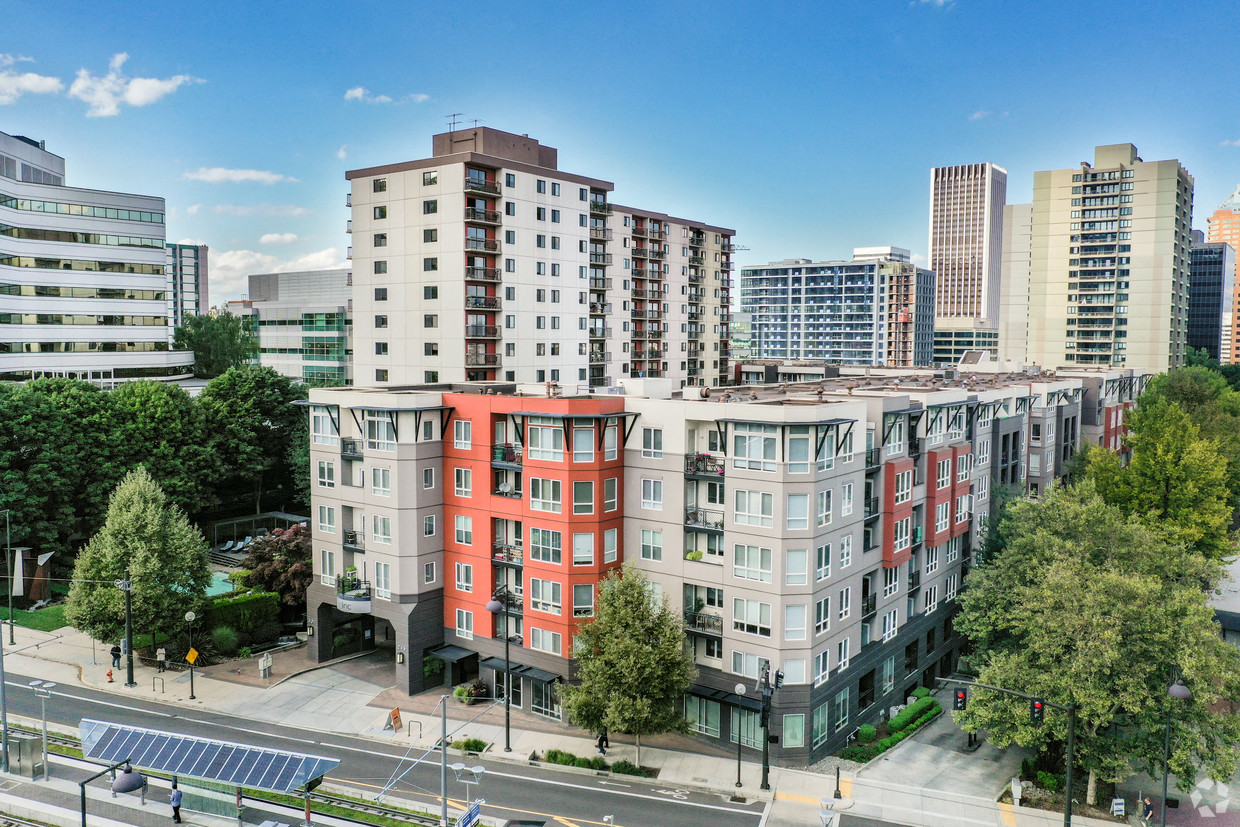 Pet-Friendly Apartments in Downtown Portland, OR - Linc301 - Red, White, and Grey Building Exterior, with Street View and Surrounding Cityscape Views