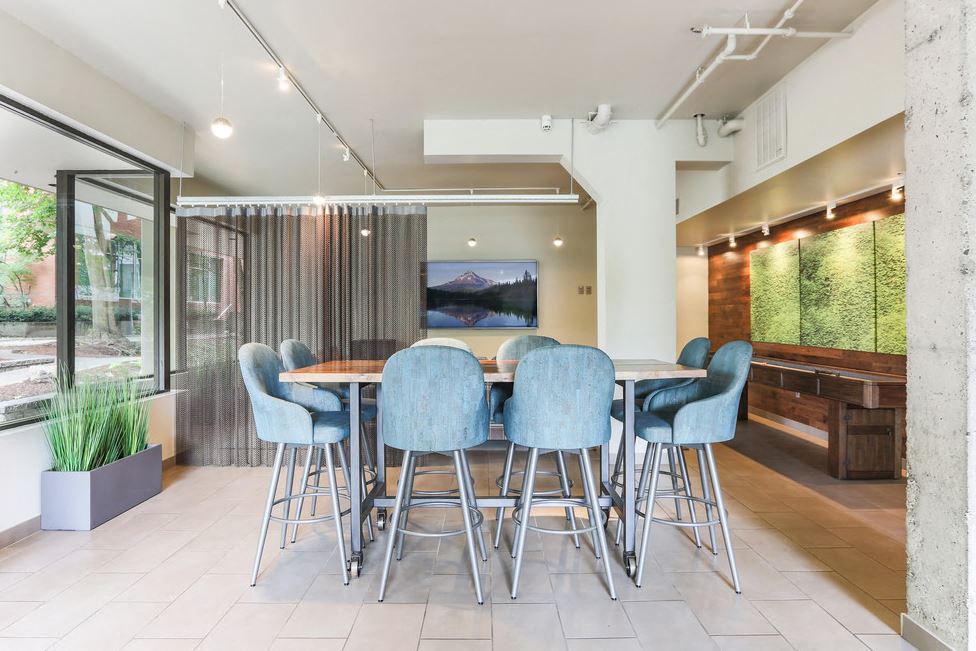 a dining room with a table and chairs