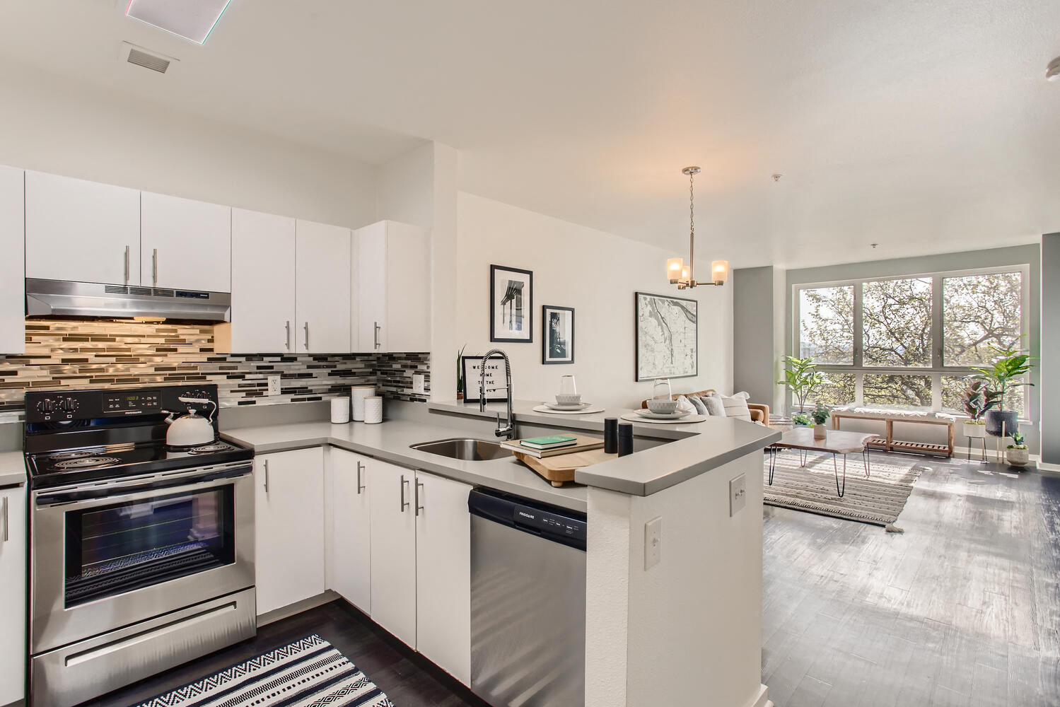 a kitchen with white cabinets and a counter top
