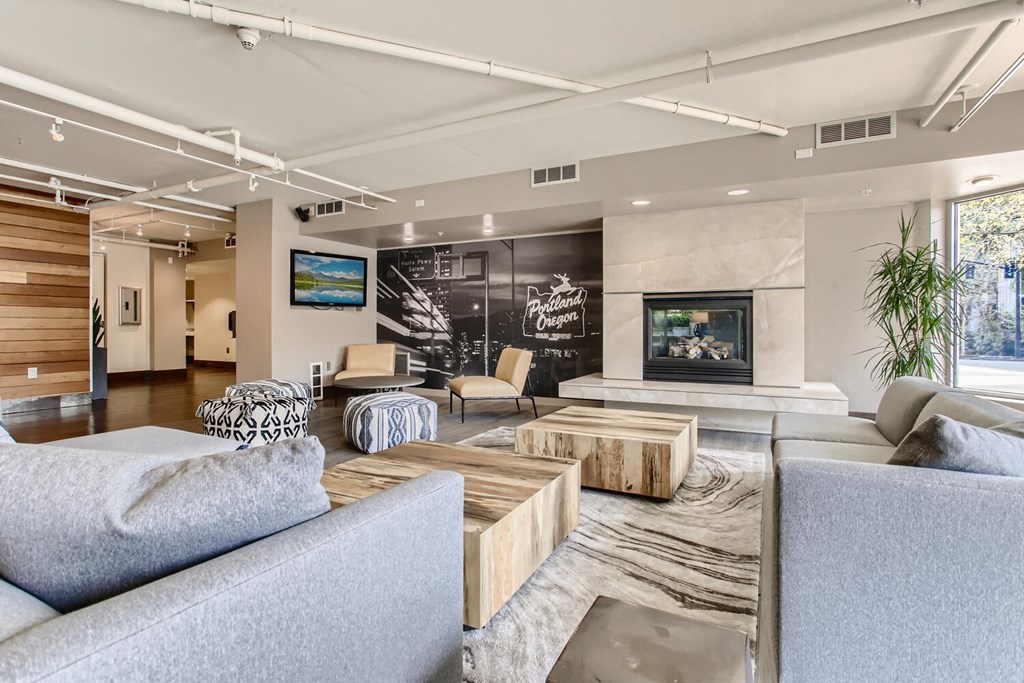 a living room with couches and chairs and a fireplace