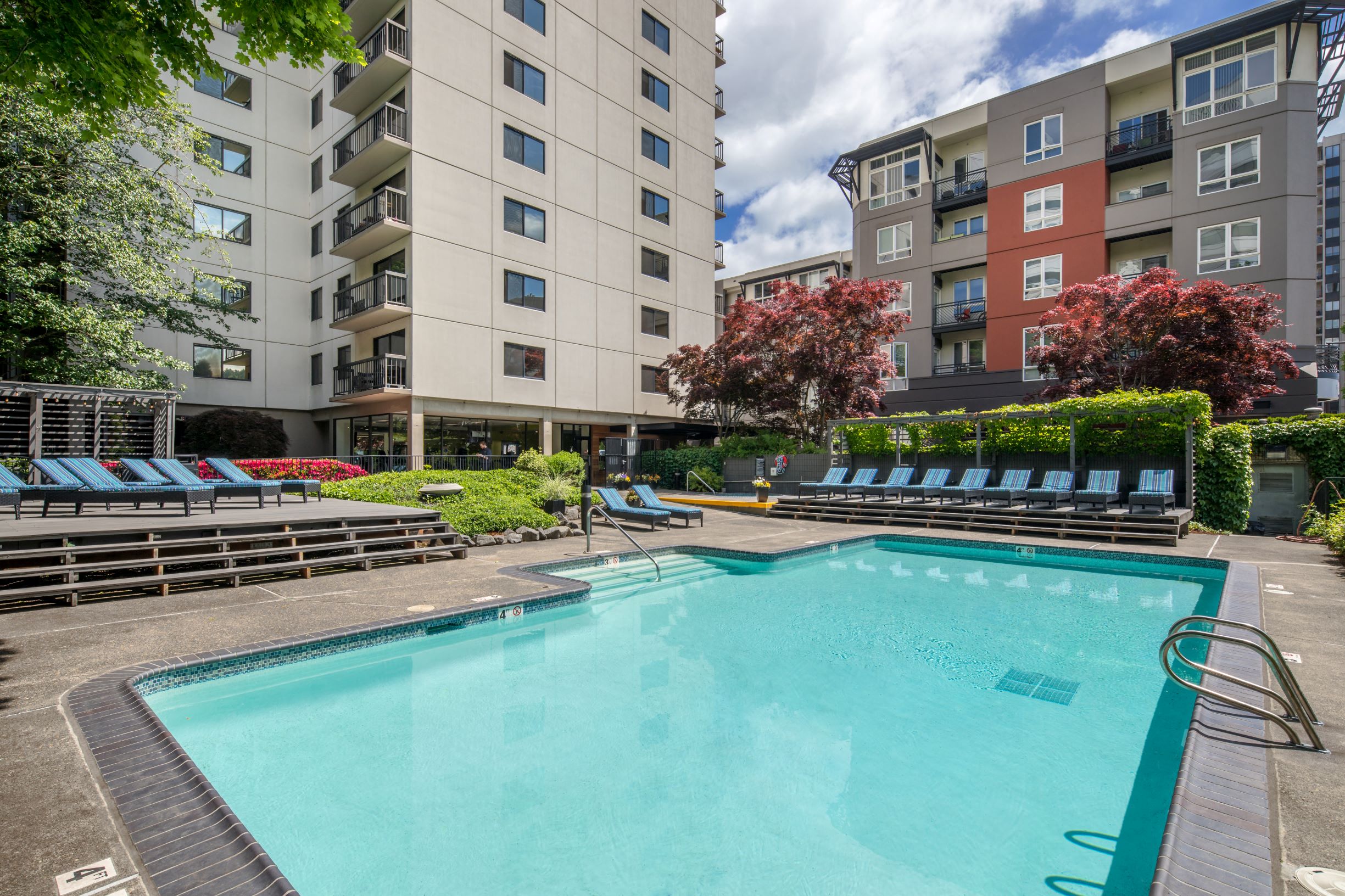 Downtown Portland OR Apartments for Rent - Linc 245 - Sparkling Pool Surrounded by Beautiful Landscaping and Comfy Lounge Seating