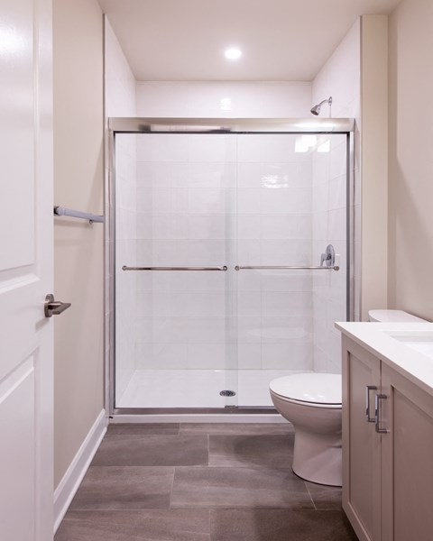 a small bathroom with a shower and a toilet