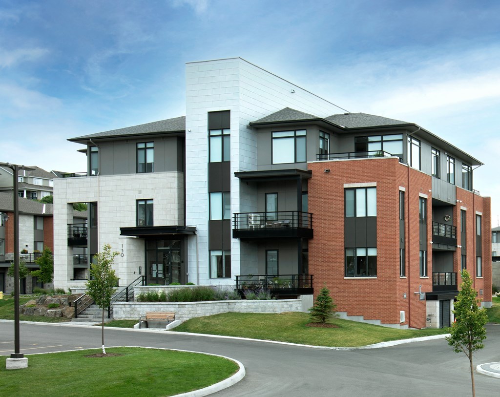 a rendering of a new apartment building on a street corner