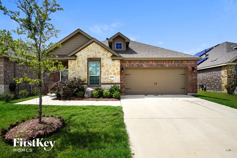 a house with a driveway and a garage door