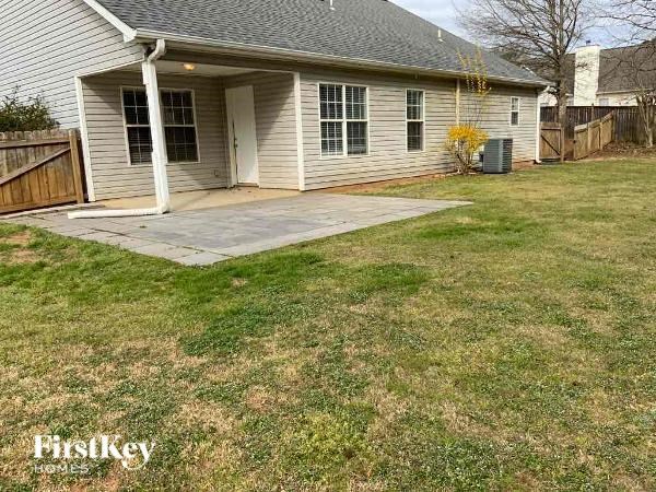 A house with a small front yard is for sale.