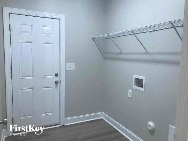 a white room with a white door and a white closet