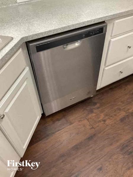 A dishwasher is built into a kitchen counter.