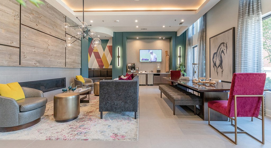 a living room and dining room with a table and chairs