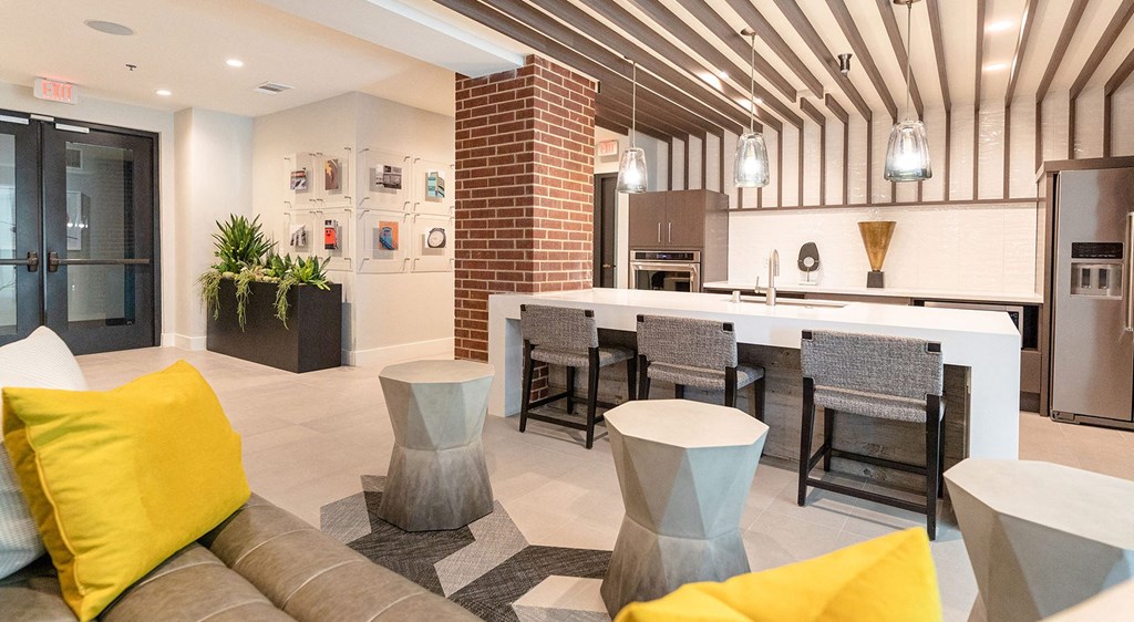 a living room with a kitchen and a dining room