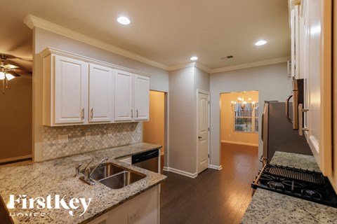 A kitchen with a sink and cabinets.