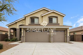 a home with a garage door with street lane homes sign on it
