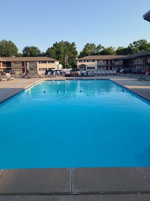 A large blue swimming pool with no people in it.