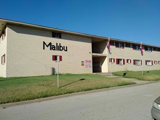 a building with the name malibu on the side of it