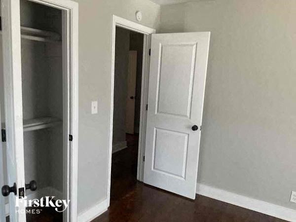 a room with a white door and a closet