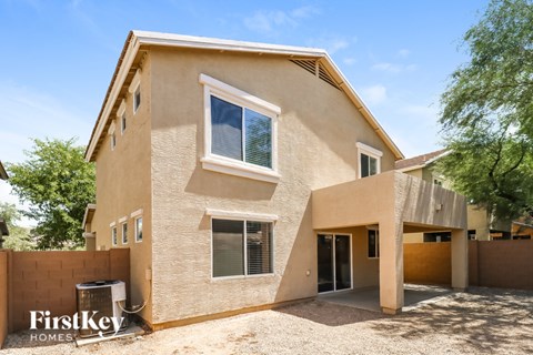 A modern house with a flat roof and a large window.