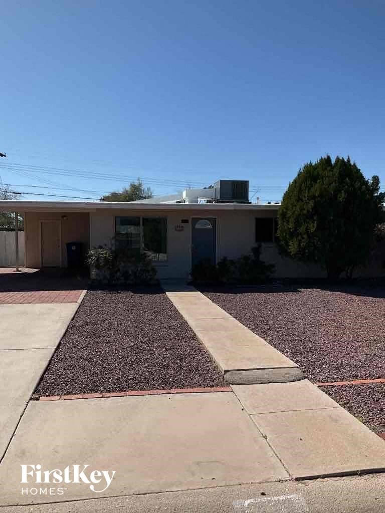 A house with a driveway in front of it.