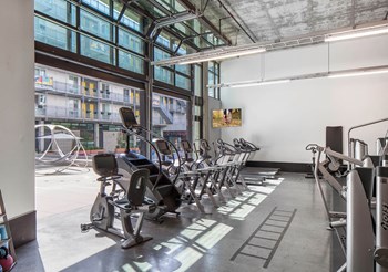Fitness center cardio equipment at Idea1 Apartments in in San Diego CA - Photo Gallery 11