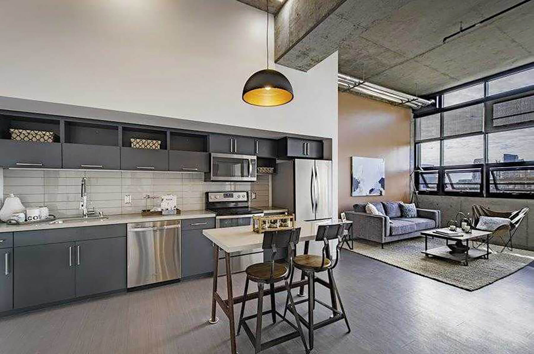 Model Concrete Kitchen and Living Room at Idea1 Apartments in San Diego CA