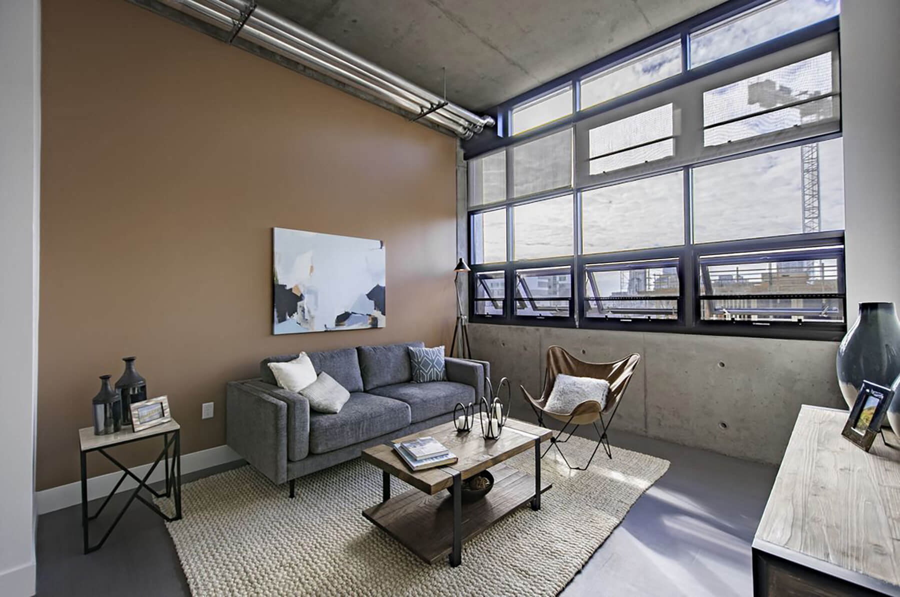 Model Concrete Living Room at Idea1 Apartments in San Diego CA