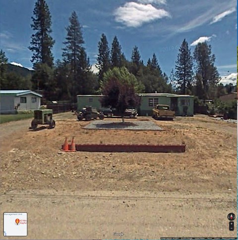 a house is being constructed in a dirt field