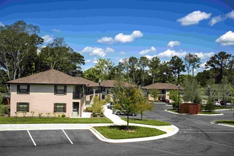 A building with a parking lot in front of it.