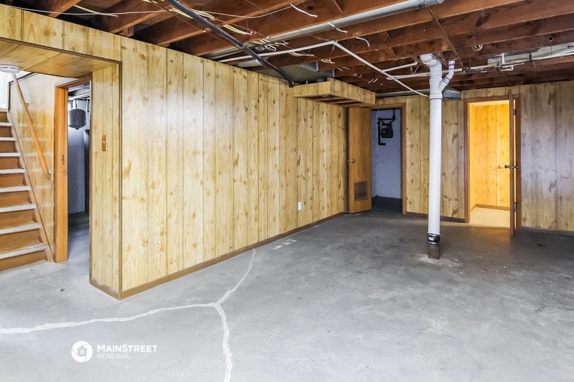 the inside of a building with wooden walls and stairs