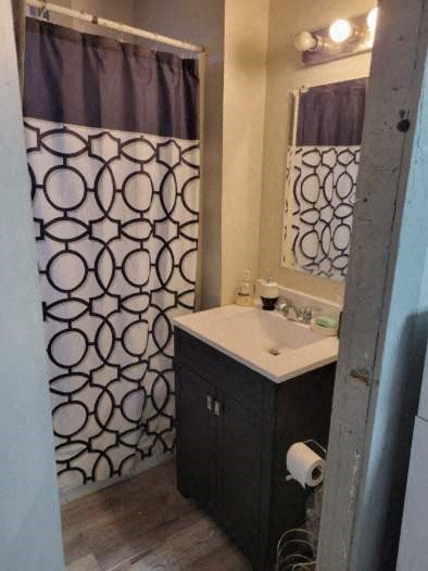 a bathroom with a sink and a shower