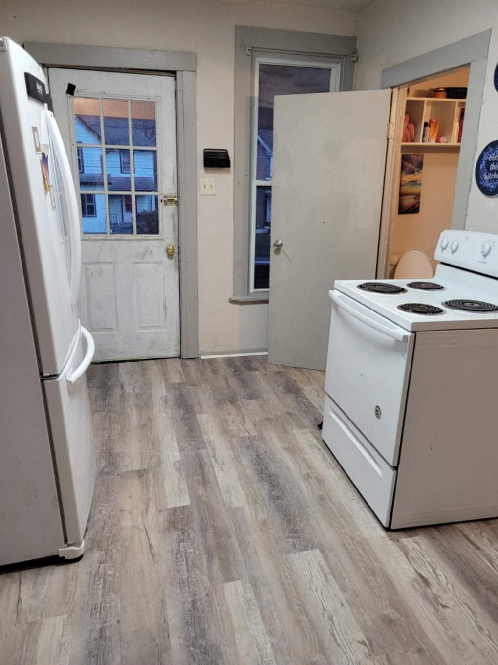 a kitchen with a stove and a refrigerator
