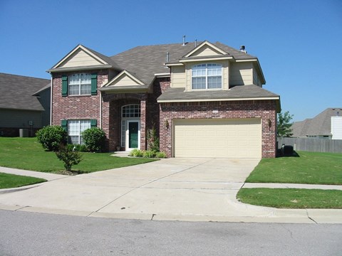 a house with a driveway and a garage door