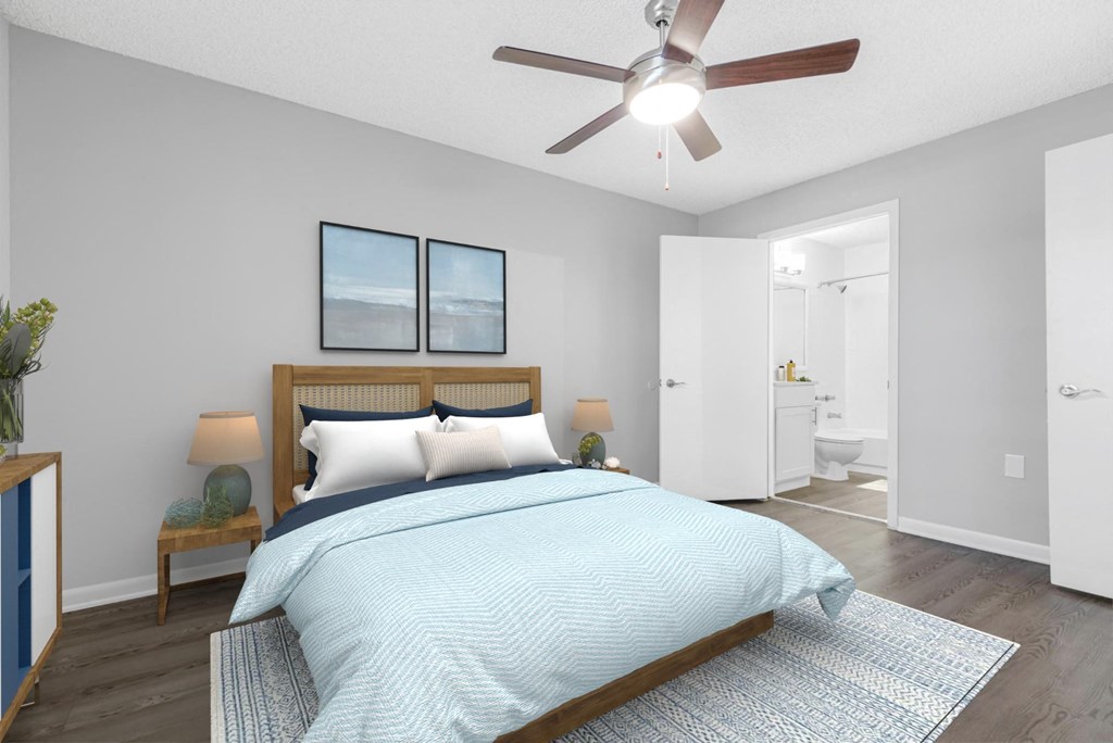 a bedroom with a bed and a ceiling fan