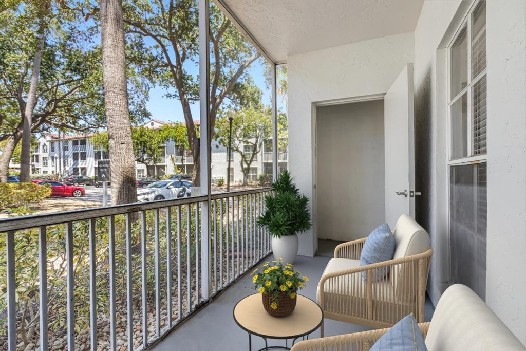 a balcony with a couch and a table